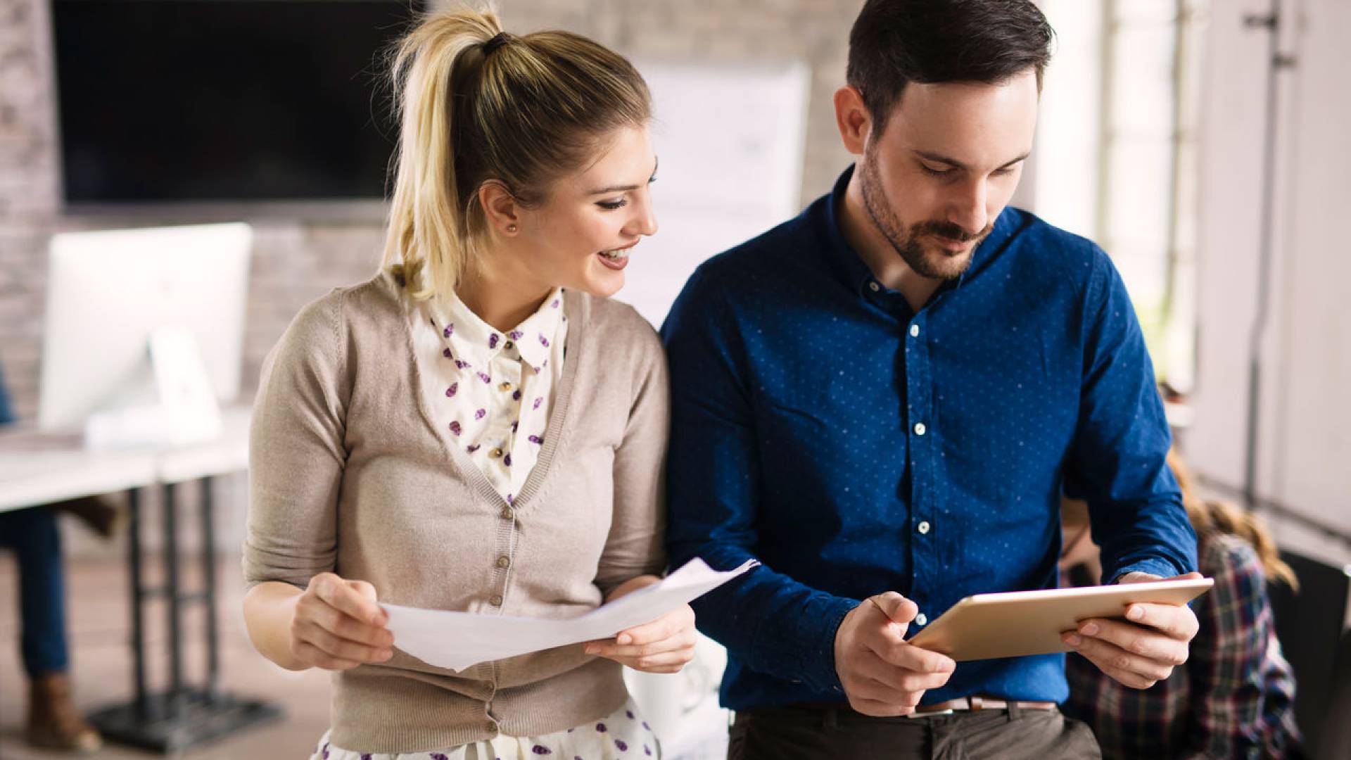 Picture of perspective designers using tablet in office