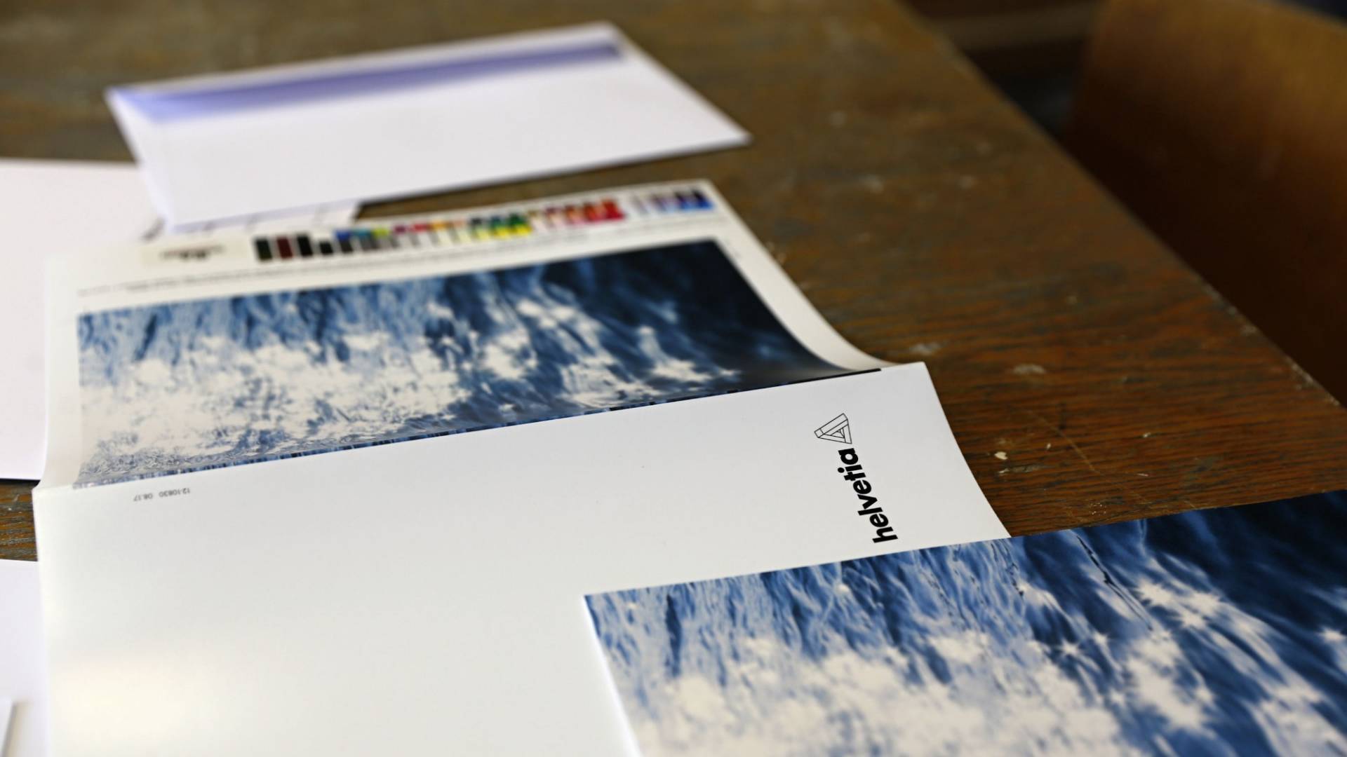 The art postcard for Edition Helvetia 2017 lying on a table.