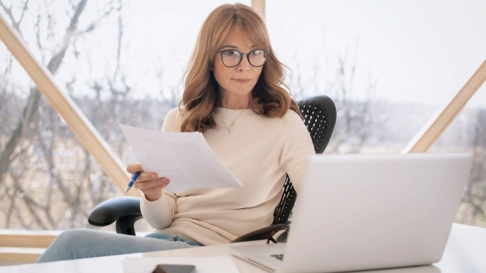 Middle aged businesswoman working from home 