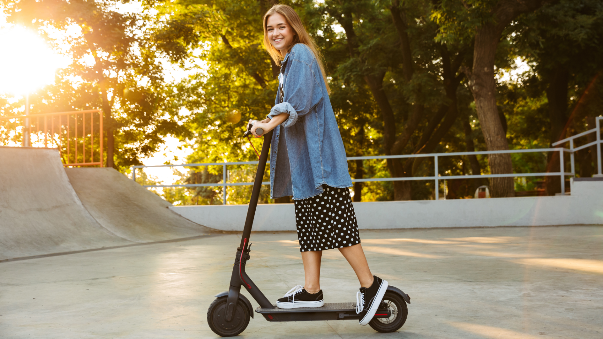 Young woman on an electric scooter.