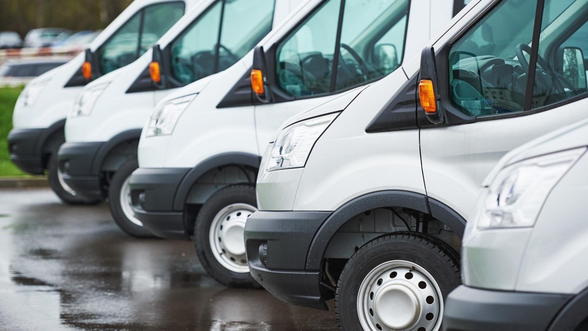 transporting service company. commercial delivery vans in row 