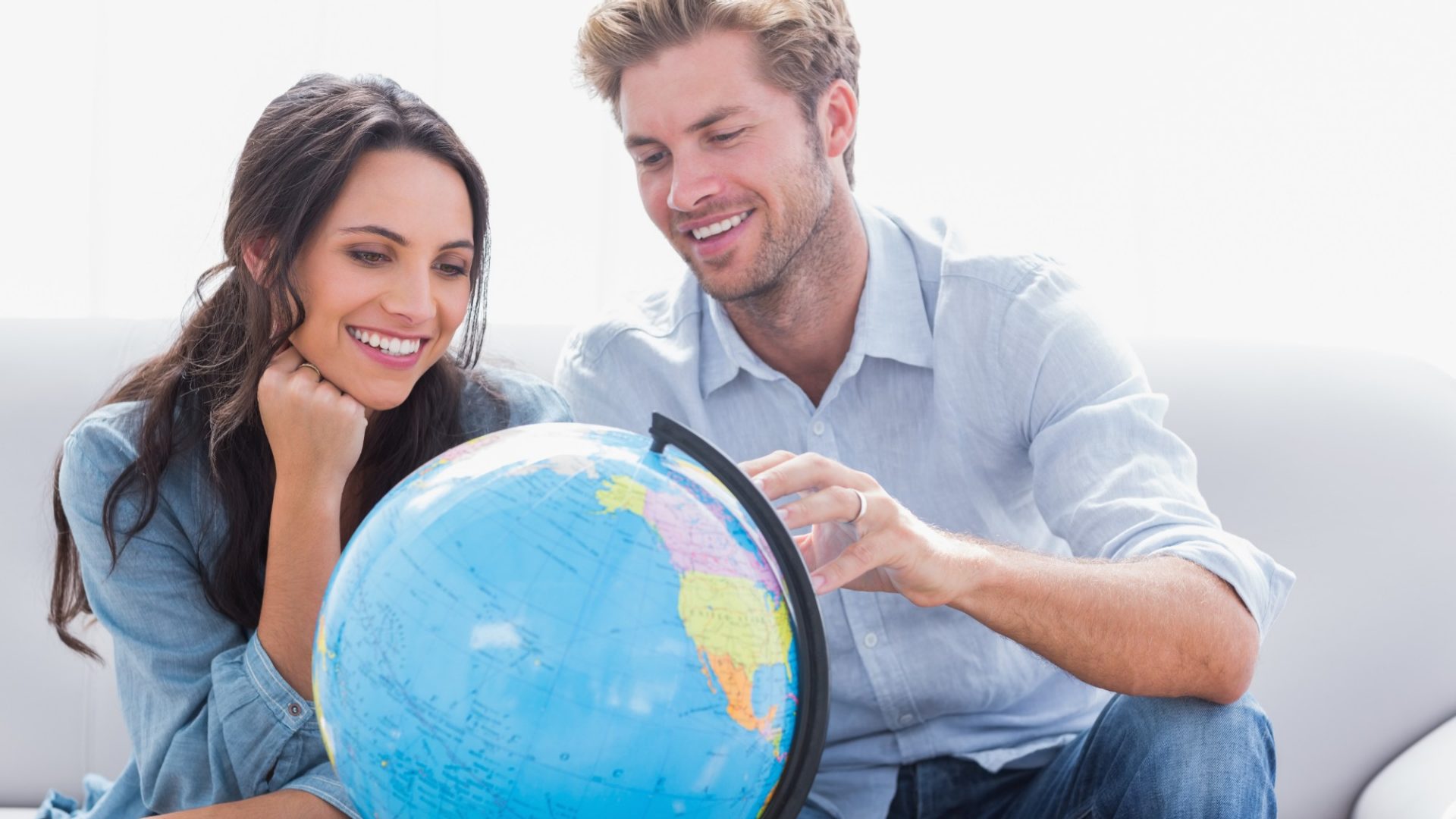 Couple looking at a globe