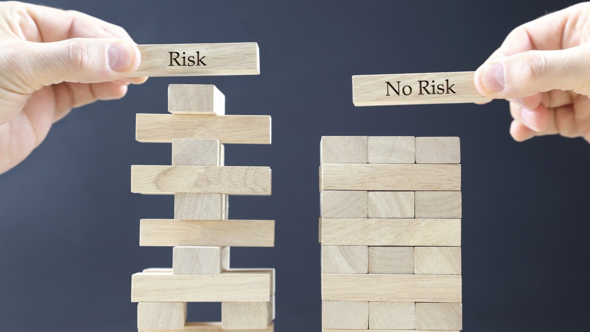 business concept with wooden blocks: risk - no risk