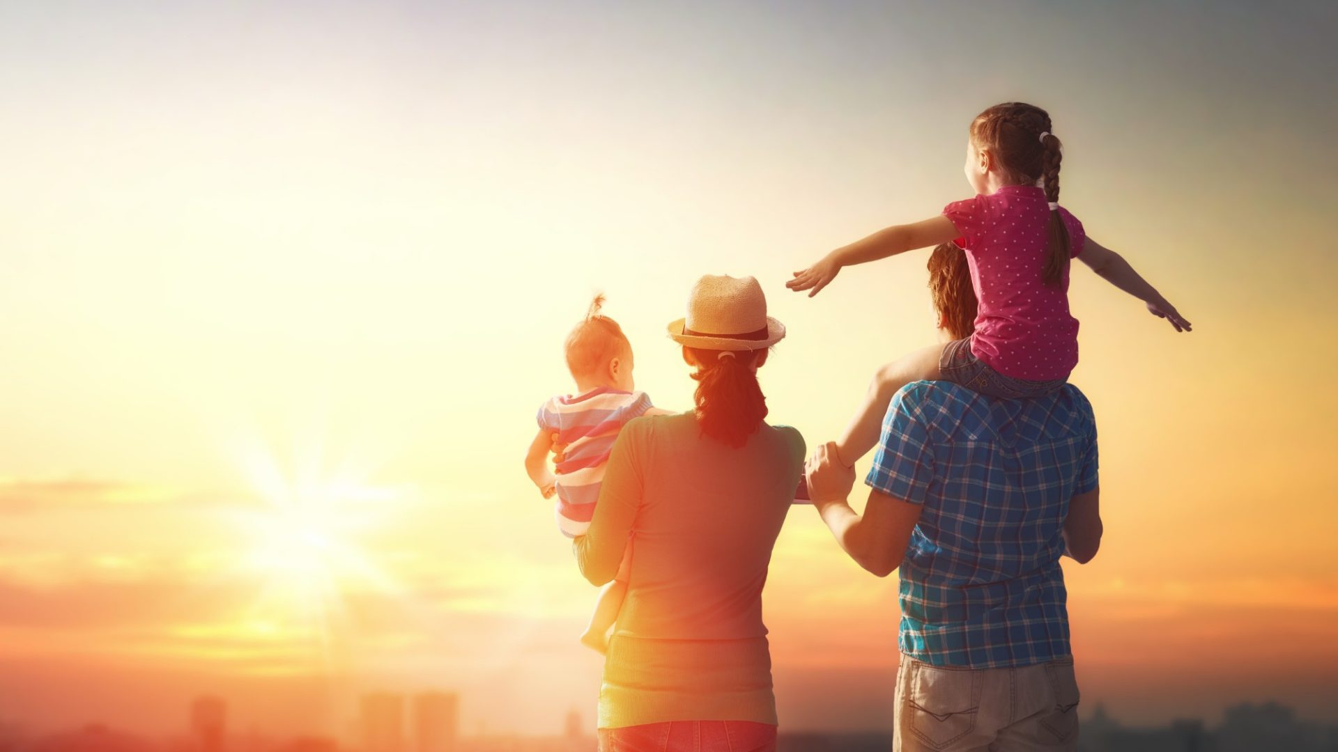 happy family at sunset.